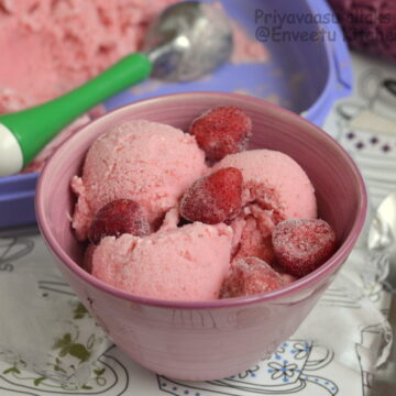 Strawberry frozen yogurt in a large bowl with berries on top