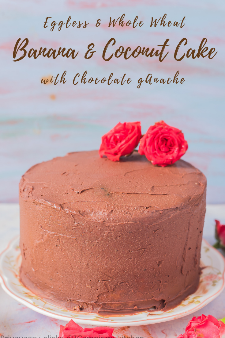 Eggless Banana coconut cake with chocolate ganache on a cake stand with roses