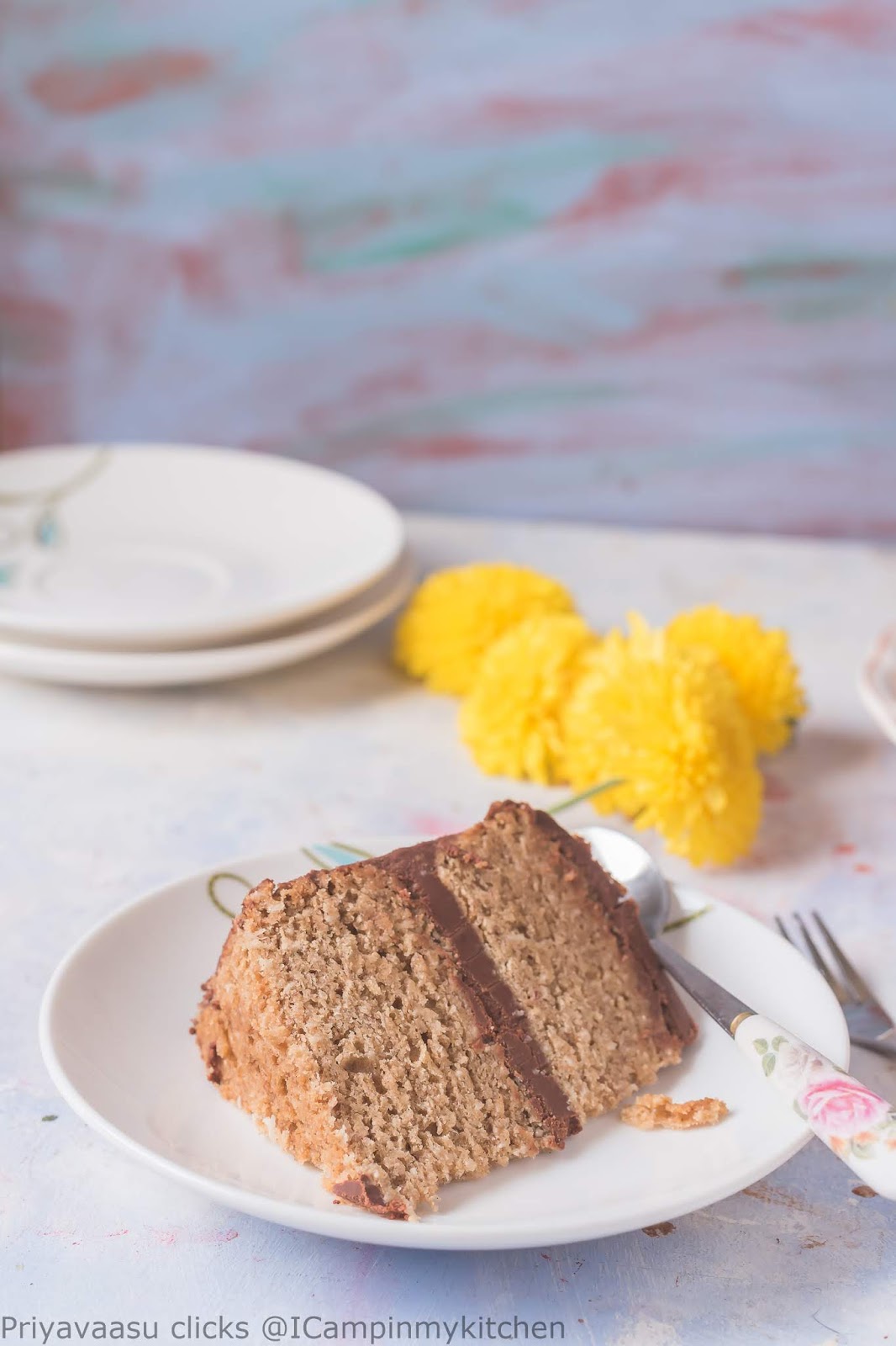 a perfect slice of coconut cake with chocolate ganache