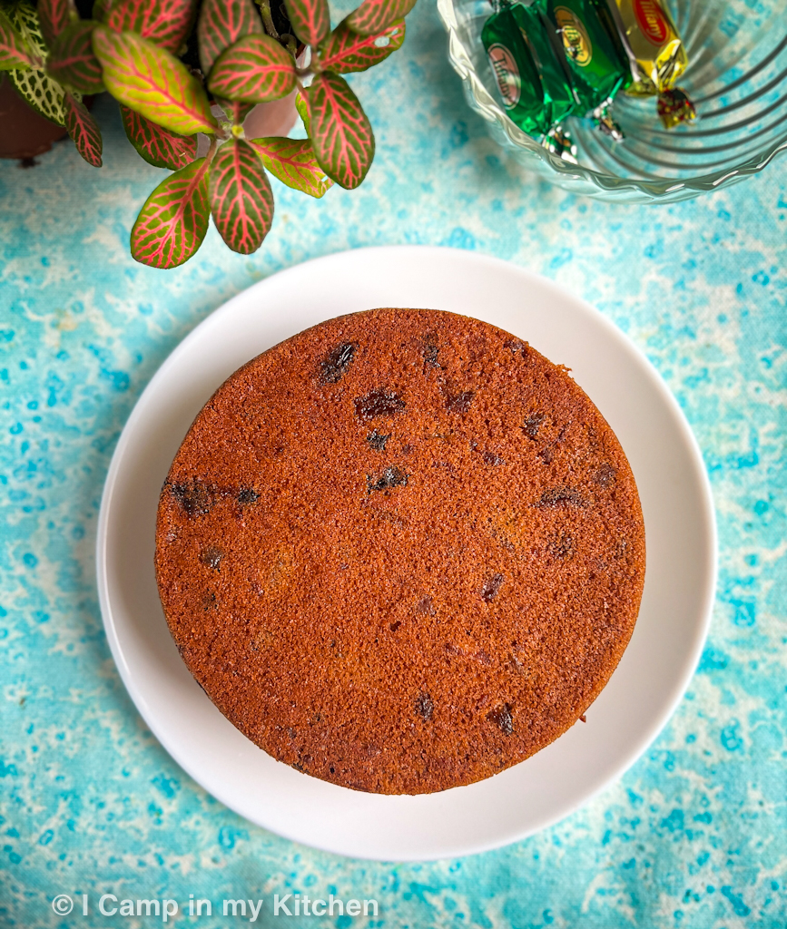 Boiled fruit cake, on a white plate with flowers around