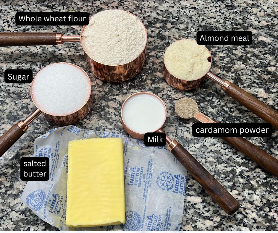 Ingredients to bake eggless whole wheat cookies with almonds