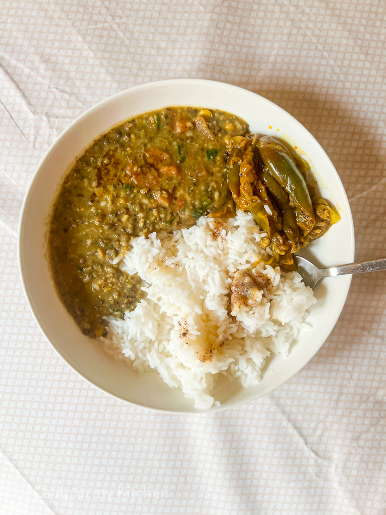 A bowl of rice with langar dal and curry