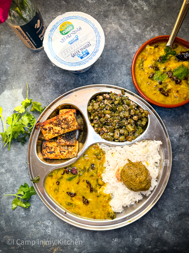 Lunch thali with dal, rice, curry and paneer